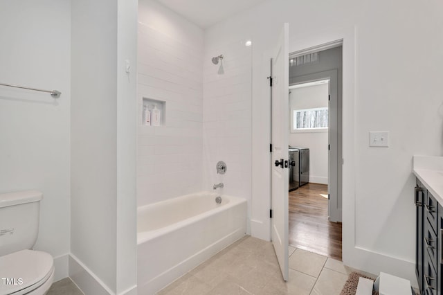 1124 Westridge Rd, Rougemont, NC 27572 - full bath featuring baseboards, toilet, shower / bathtub combination, tile patterned floors, and washer / clothes dryer