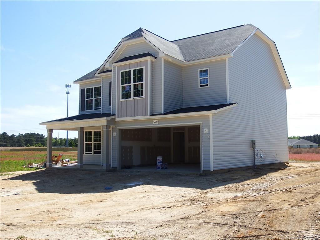 view of front of property with driveway and an attached garage