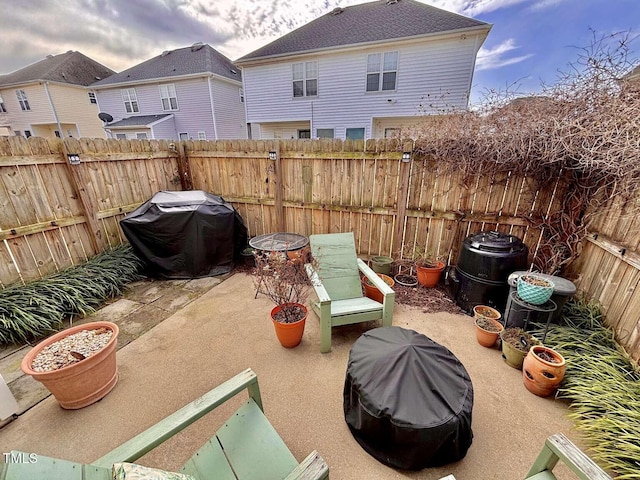 view of patio with a fenced backyard and area for grilling