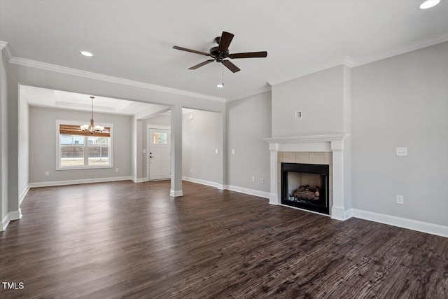 unfurnished living room with baseboards, dark wood finished floors, and a tile fireplace