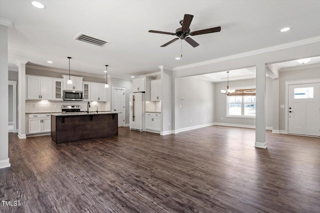 kitchen with stainless steel appliances, tasteful backsplash, visible vents, dark wood-type flooring, and open floor plan