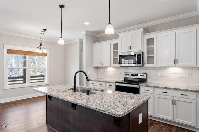 kitchen with dark wood-type flooring, a sink, white cabinetry, appliances with stainless steel finishes, and crown molding