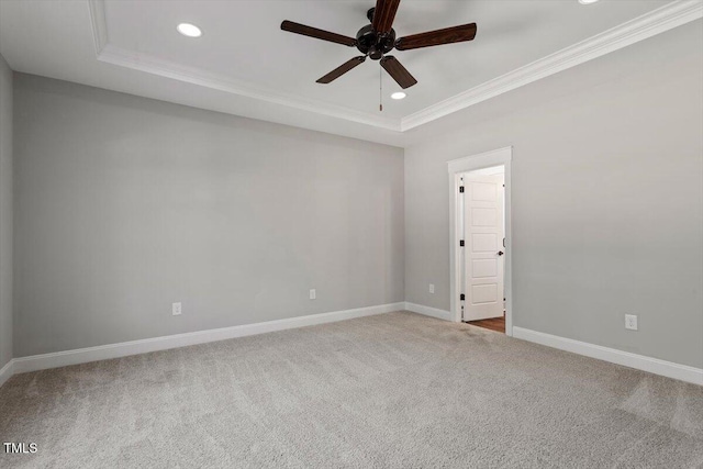 spare room featuring carpet, baseboards, crown molding, and recessed lighting