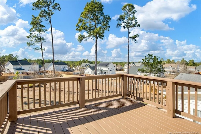 wooden deck featuring a residential view