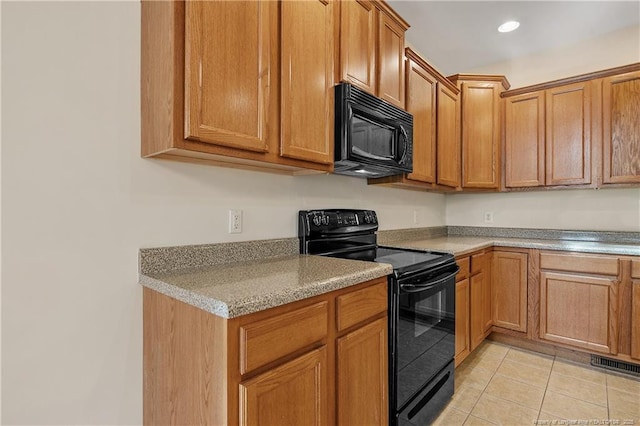 kitchen featuring light tile patterned floors, visible vents, brown cabinetry, black appliances, and recessed lighting