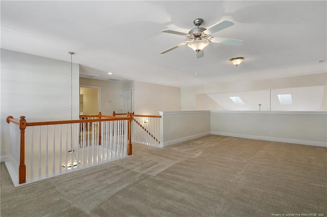 interior space featuring a ceiling fan and baseboards