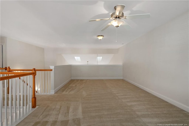 additional living space with carpet and baseboards