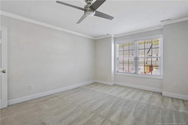 unfurnished room featuring ornamental molding, visible vents, and carpet floors