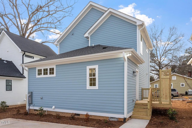 exterior space with crawl space and a wooden deck