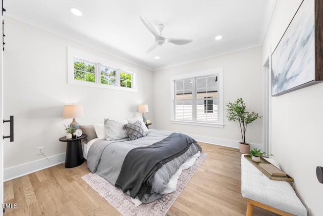 bedroom featuring light wood-style floors, ornamental molding, and recessed lighting