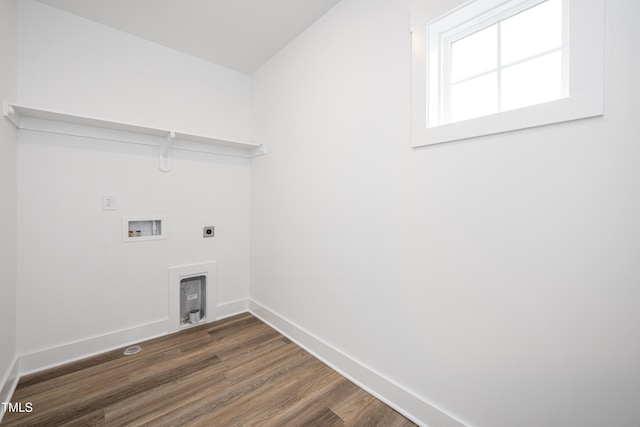 laundry room featuring hookup for an electric dryer, laundry area, dark wood-style flooring, washer hookup, and baseboards