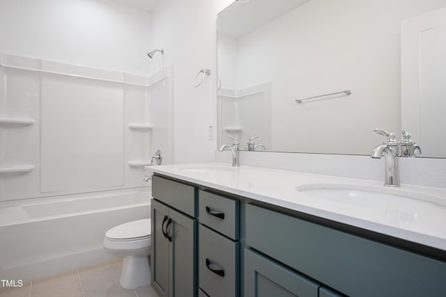 full bathroom with double vanity, toilet, tile patterned flooring, tub / shower combination, and a sink