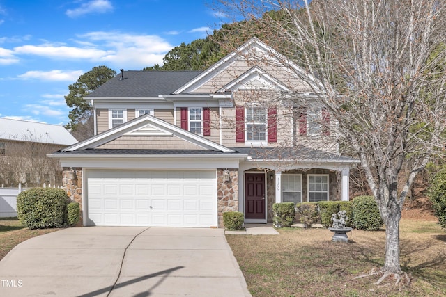 view of front of property featuring a garage, stone siding, and concrete driveway