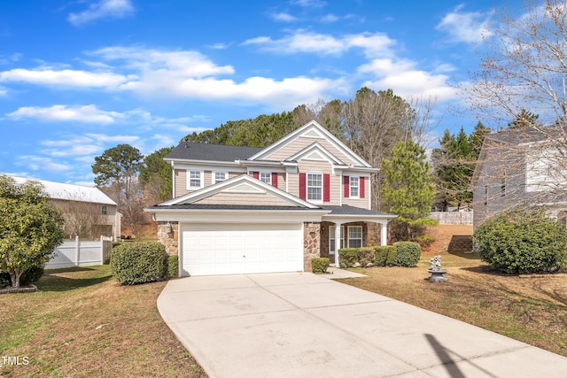 traditional-style home with a garage, stone siding, a front lawn, and concrete driveway