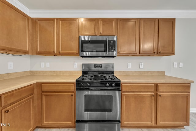 kitchen with appliances with stainless steel finishes and light countertops