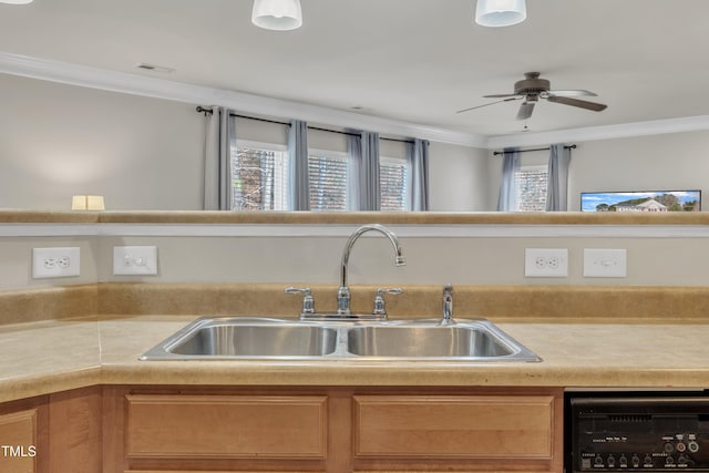 kitchen with crown molding, light countertops, visible vents, a sink, and dishwashing machine