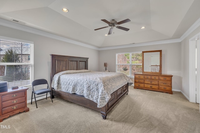 bedroom with light carpet, visible vents, and multiple windows