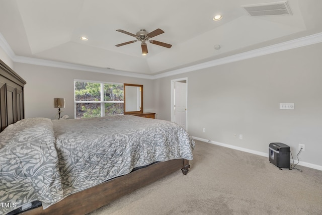 bedroom featuring carpet floors, crown molding, a raised ceiling, visible vents, and baseboards