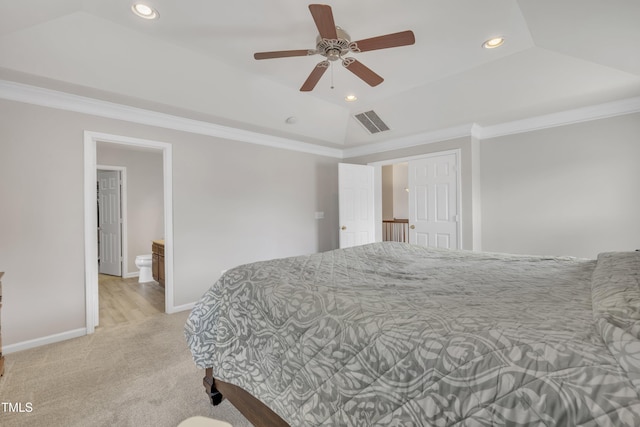 bedroom with lofted ceiling, visible vents, and crown molding