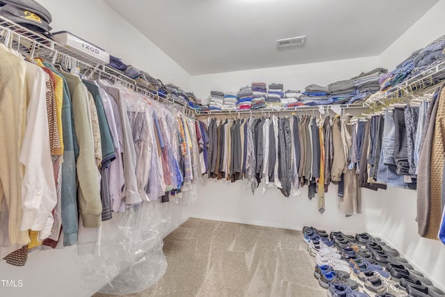 spacious closet with carpet and visible vents