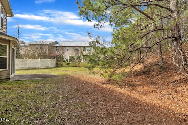 view of yard with a patio area and fence