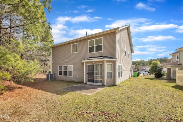 rear view of property with central AC, a lawn, and a patio