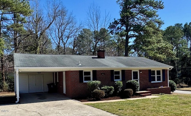 ranch-style house with a carport, driveway, brick siding, and a front lawn