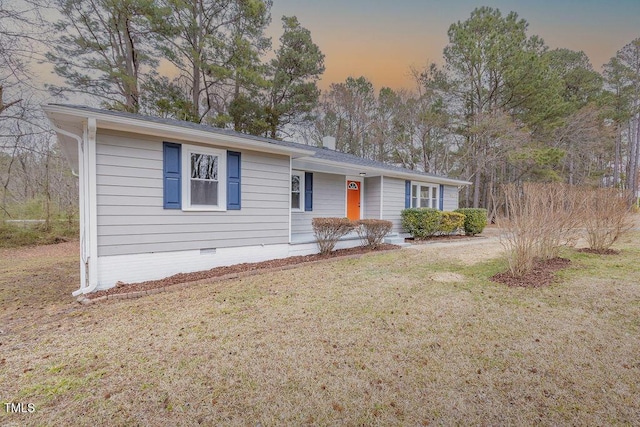 ranch-style house featuring crawl space and a lawn