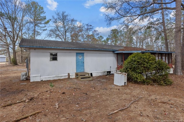 back of property featuring entry steps