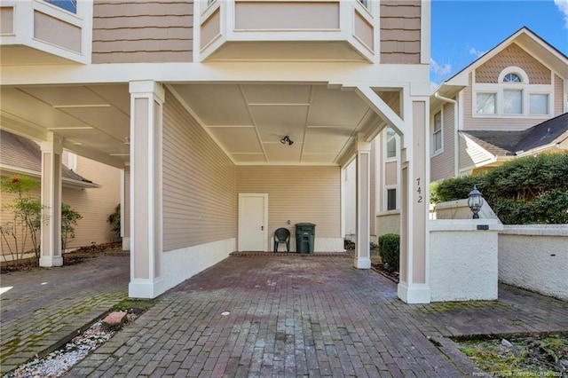 exterior space featuring a carport and driveway