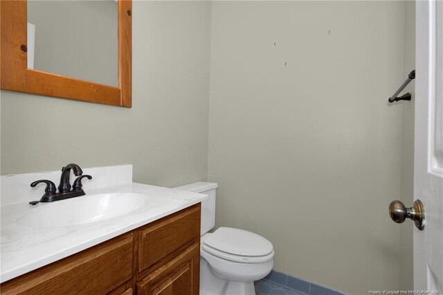 bathroom with toilet and vanity