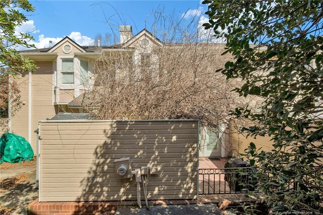 view of property exterior with fence