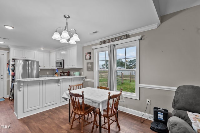 dining area with dark wood-style floors, visible vents, crown molding, and baseboards