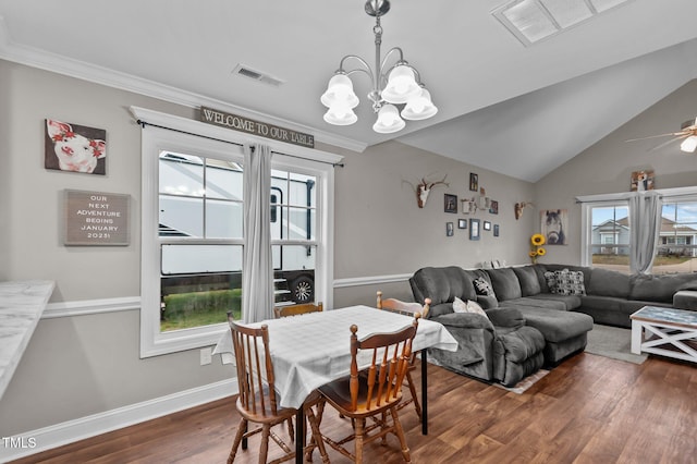 dining area featuring dark wood-type flooring, lofted ceiling, visible vents, and baseboards