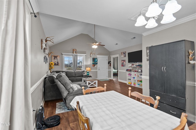 dining area featuring visible vents, vaulted ceiling, wood finished floors, and ceiling fan with notable chandelier