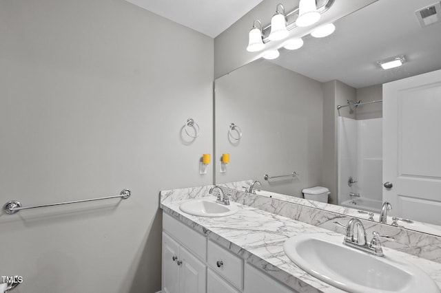 full bathroom featuring double vanity, visible vents, tub / shower combination, and a sink