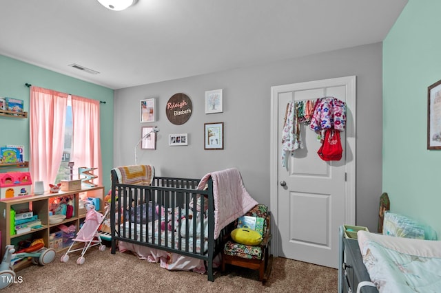 carpeted bedroom featuring visible vents