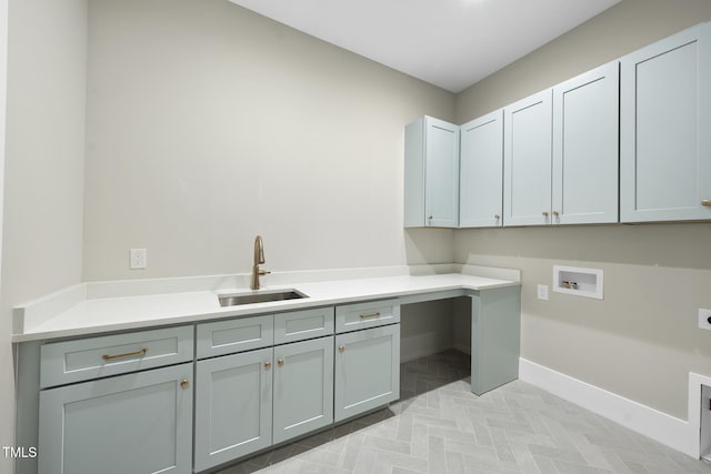 clothes washing area featuring hookup for a washing machine, a sink, baseboards, cabinet space, and electric dryer hookup