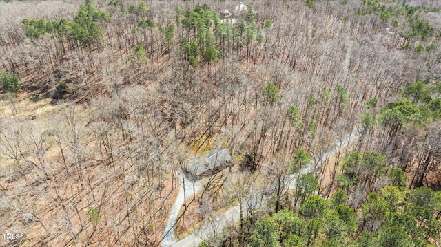 bird's eye view featuring a forest view