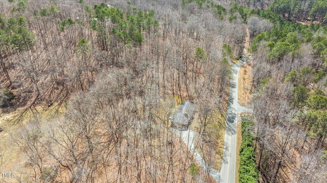 drone / aerial view featuring a view of trees