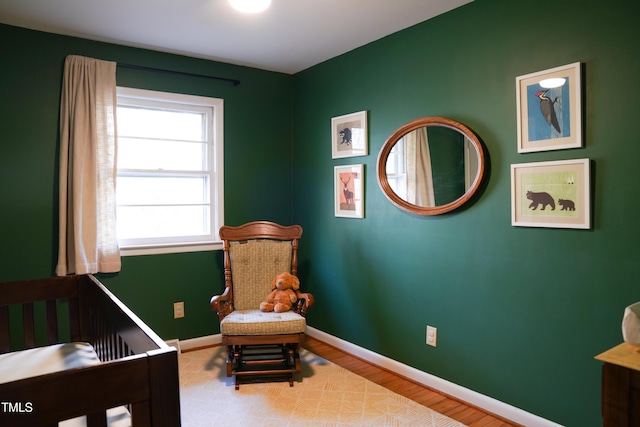 bedroom with baseboards and wood finished floors