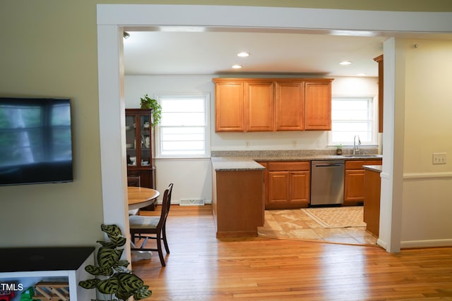 kitchen with visible vents, light wood finished floors, recessed lighting, a sink, and dishwasher