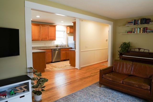 living area featuring recessed lighting and light wood finished floors