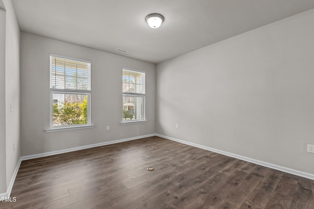 717 Tailrace Falls Ct, Wake Forest, NC 27587 - spare room featuring dark wood finished floors and baseboards