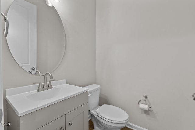 717 Tailrace Falls Ct, Wake Forest, NC 27587 - half bathroom with vanity, toilet, and baseboards