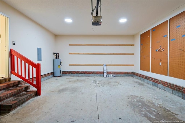 garage with a garage door opener, electric panel, and electric water heater