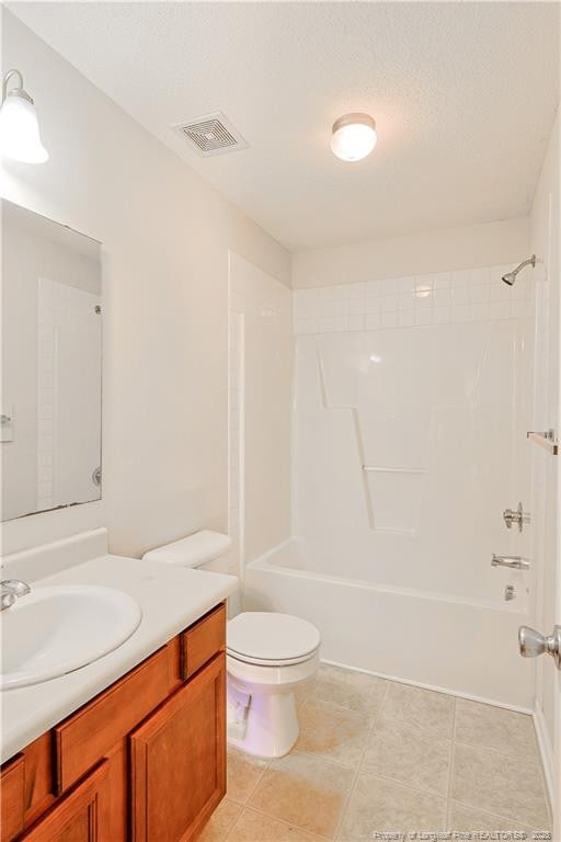 full bath with bathtub / shower combination, visible vents, toilet, vanity, and tile patterned floors