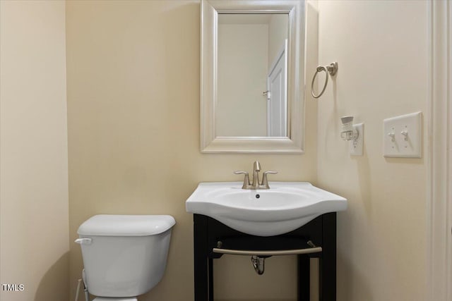 half bath with a sink and toilet