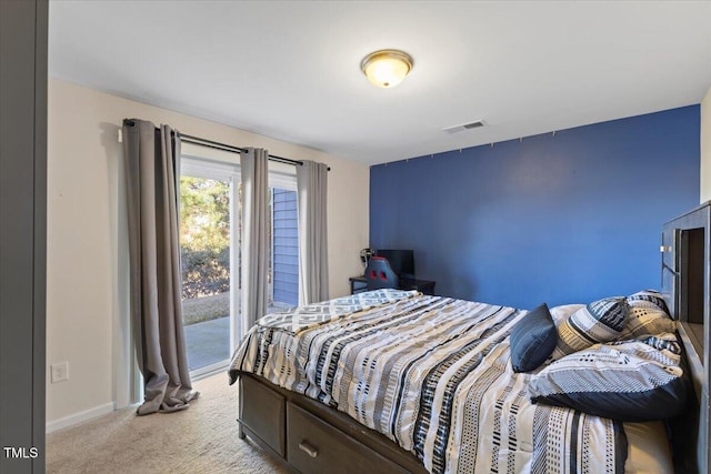 bedroom featuring light carpet, access to outside, visible vents, and baseboards