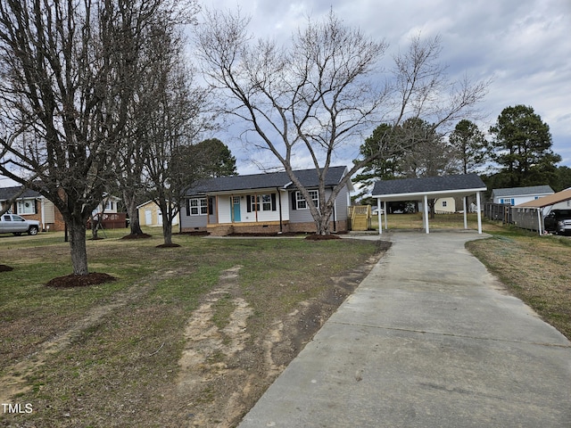 view of front of home with crawl space, fence, a carport, and concrete driveway